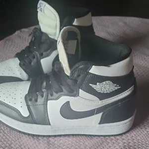 Air Jordan Black and White High-Top Sneakers