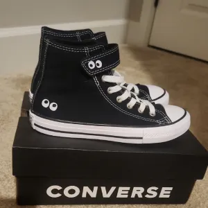 Converse Black High-Top Sneakers Unique Eye Design