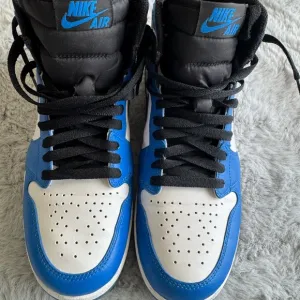 Jordan 1.5.    Nike Air Blue and White High-Top Sneakers