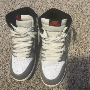 Jordan 1’s High-Top Sneakers - White and Gray