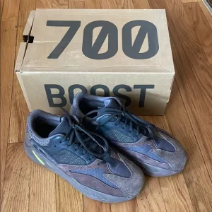 Yeezy Gray and Black Sneakers with Boost Cushioning